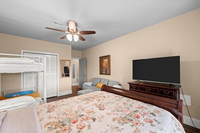 bedroom with ceiling fan and hardwood / wood-style flooring