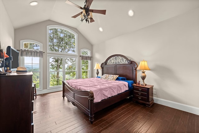 bedroom with ceiling fan, dark wood-type flooring, and lofted ceiling