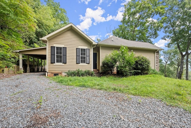 view of front of property featuring a carport