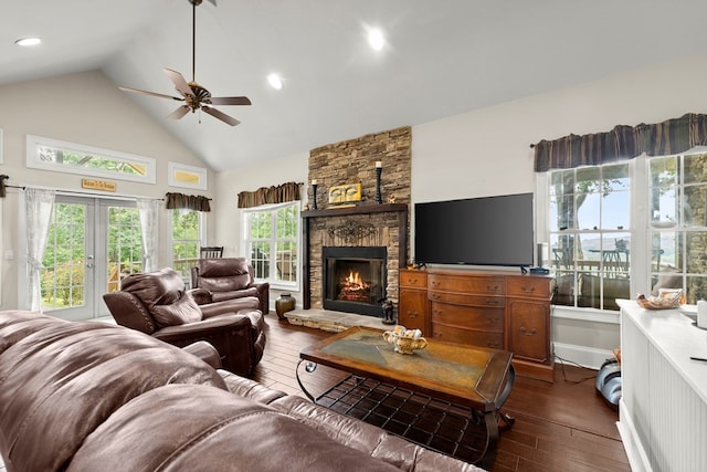 living room with a fireplace, high vaulted ceiling, dark wood-type flooring, and ceiling fan