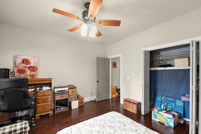 bedroom with a closet, ceiling fan, and dark hardwood / wood-style flooring