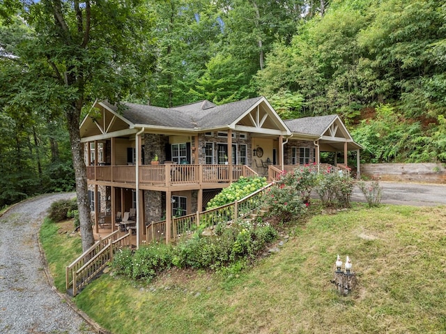 view of front of house with a front yard and covered porch