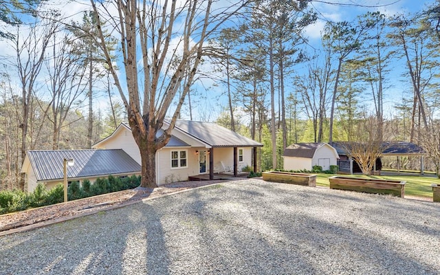 ranch-style house with a storage unit