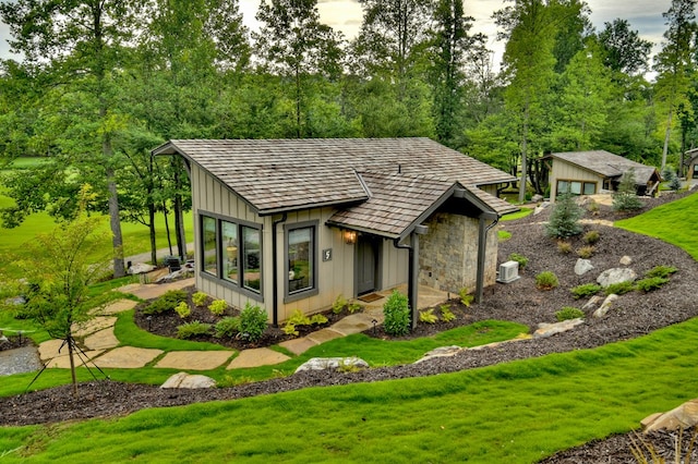 view of outdoor structure with a lawn