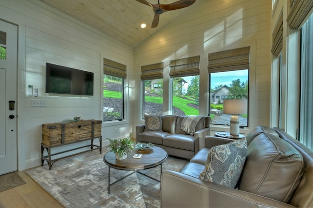 sunroom / solarium featuring ceiling fan, wooden ceiling, and vaulted ceiling