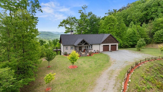 single story home with dirt driveway, an attached garage, a front lawn, and a chimney