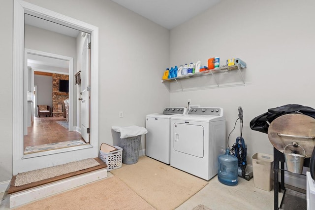 washroom with washing machine and dryer