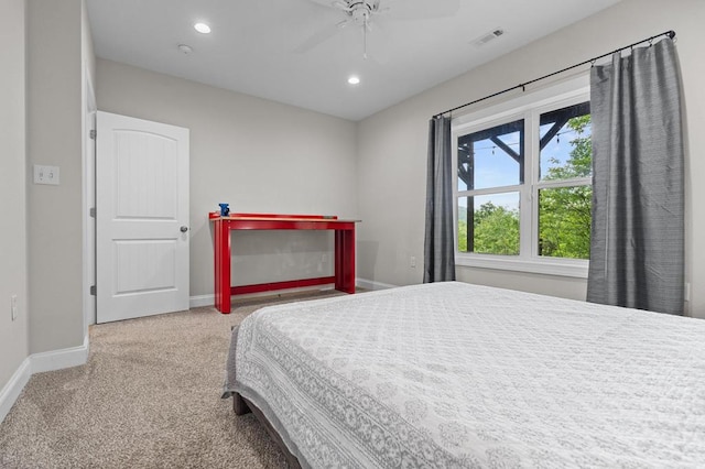 carpeted bedroom featuring baseboards, recessed lighting, and a ceiling fan