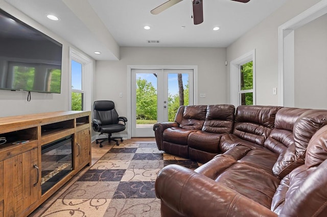 living area featuring recessed lighting, french doors, a ceiling fan, and light wood finished floors