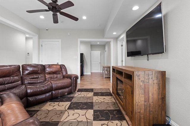 living room with recessed lighting, ceiling fan, wood finished floors, and baseboards