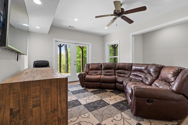 living area with french doors, recessed lighting, a ceiling fan, and light wood finished floors