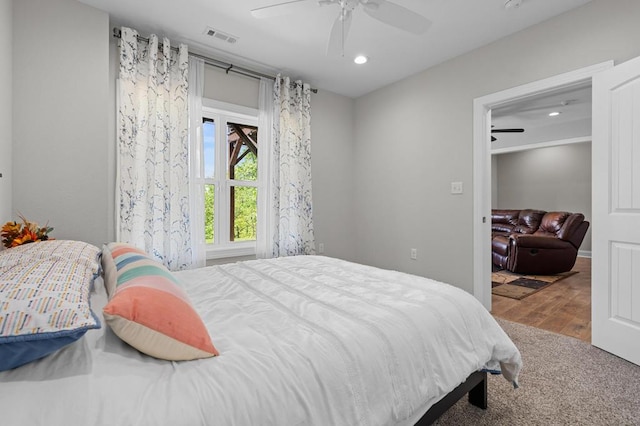 bedroom with recessed lighting, ceiling fan, and wood finished floors