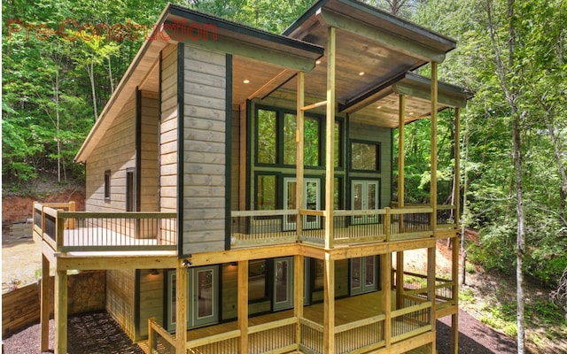 exterior space featuring a wooden deck and french doors