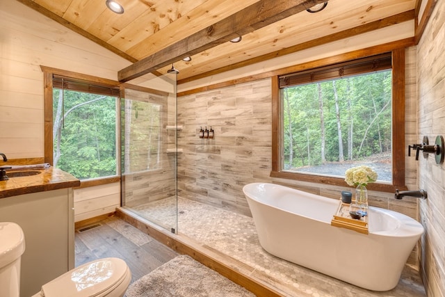 full bath featuring wood finished floors, wood ceiling, a soaking tub, a tile shower, and toilet