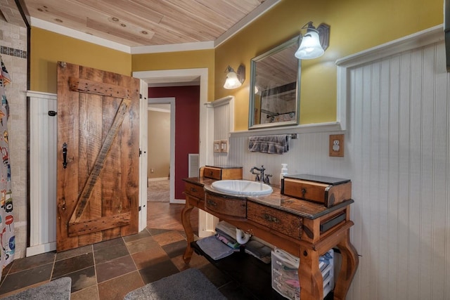bathroom with visible vents, wainscoting, wood ceiling, and vanity