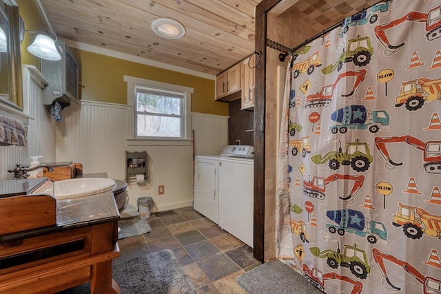 full bathroom featuring curtained shower, washing machine and dryer, wainscoting, wood ceiling, and vanity