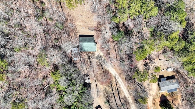 birds eye view of property with a view of trees