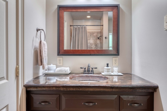 bathroom with vanity and walk in shower