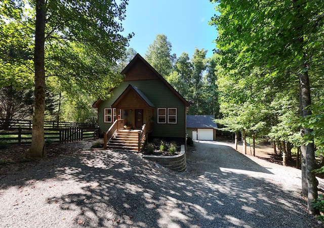 view of front facade featuring an outbuilding and a garage