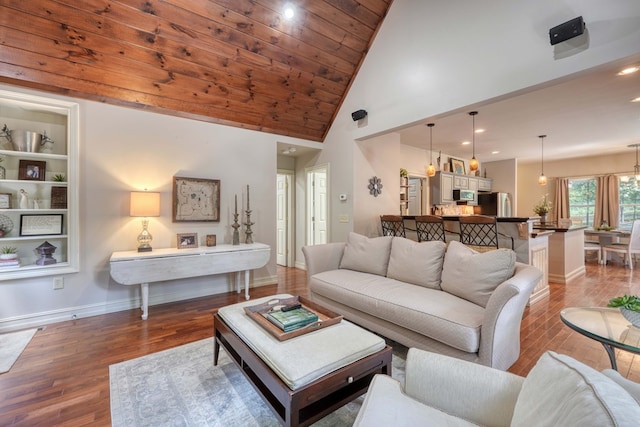 living room with hardwood / wood-style flooring, wooden ceiling, high vaulted ceiling, and an inviting chandelier