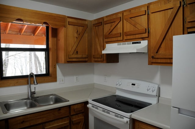 kitchen featuring sink and white appliances