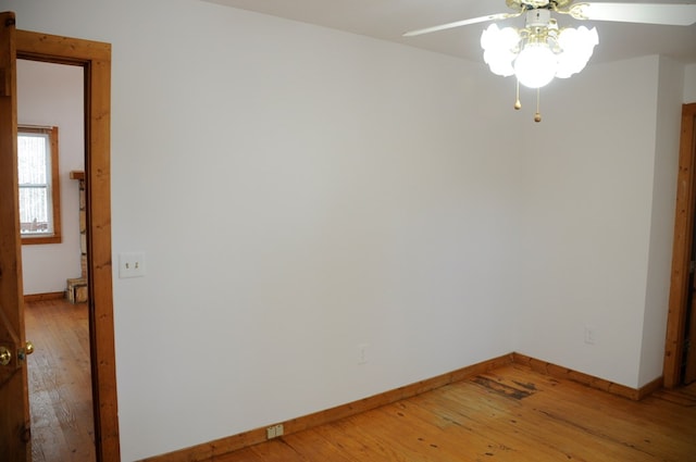 unfurnished room with ceiling fan and wood-type flooring