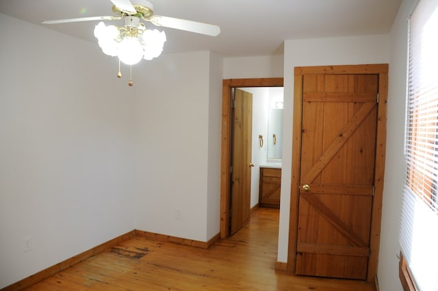 empty room featuring ceiling fan and light hardwood / wood-style floors