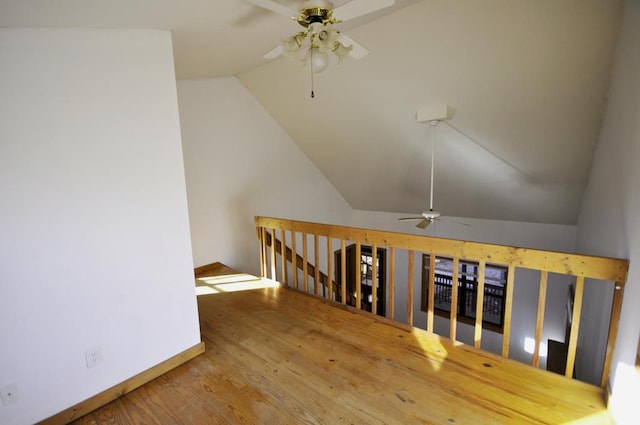 interior space with hardwood / wood-style floors, ceiling fan, and lofted ceiling