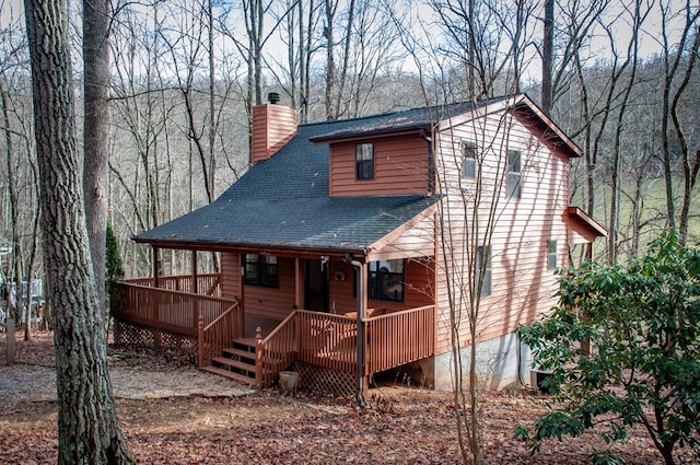 rear view of property with a deck