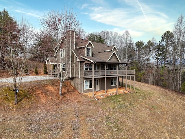 back of property with a balcony