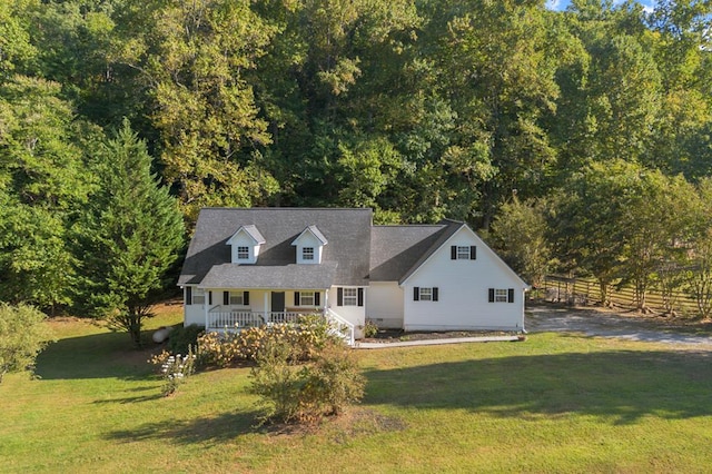 cape cod home featuring a front yard and covered porch