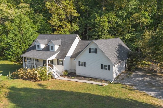 cape cod-style house with covered porch and a front lawn