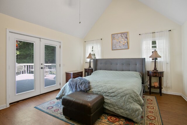 bedroom with multiple windows, french doors, access to exterior, and hardwood / wood-style floors