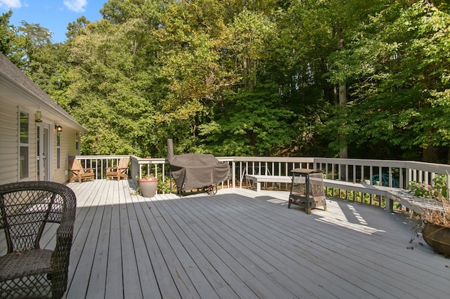 deck featuring a grill