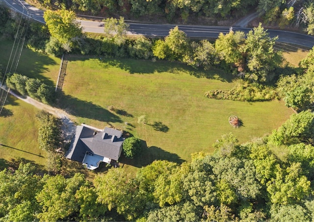 birds eye view of property with a rural view