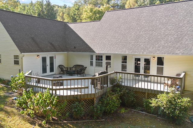 back of house with french doors and a deck