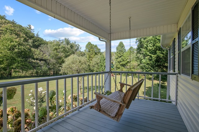 deck featuring a lawn