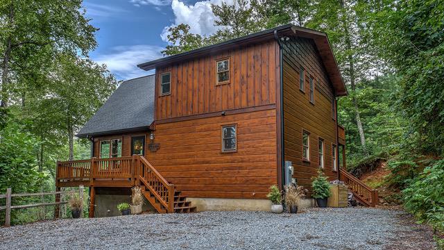 rear view of property with a deck