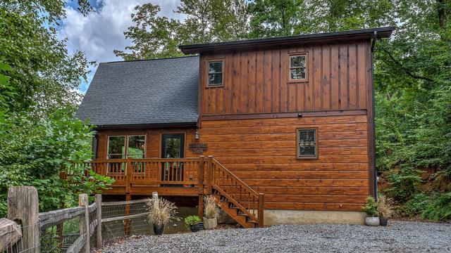 back of property with a wooden deck