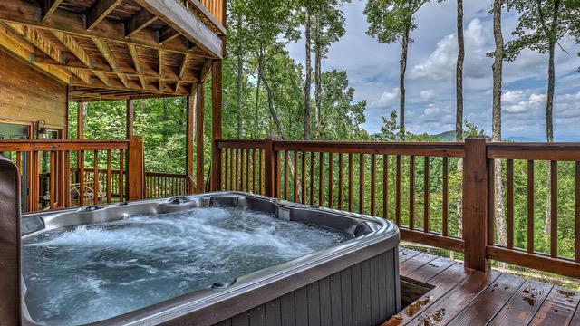 deck with a hot tub