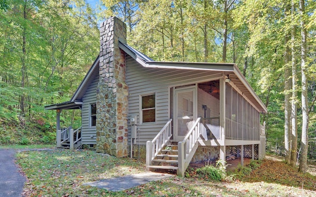 view of front facade with a sunroom