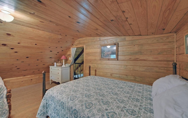 bedroom featuring wooden ceiling, vaulted ceiling, hardwood / wood-style flooring, and wooden walls