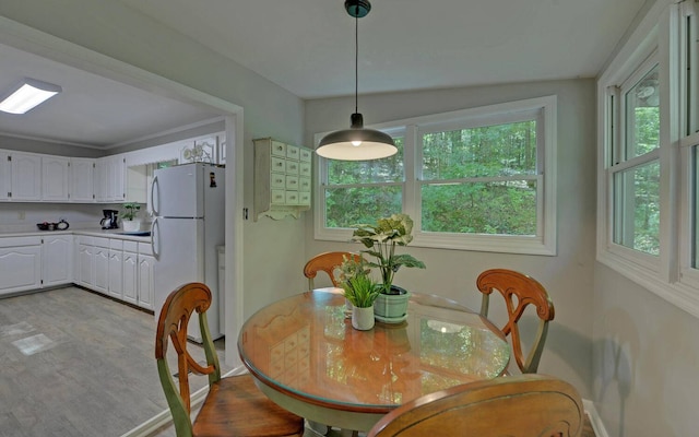 dining room with vaulted ceiling and plenty of natural light