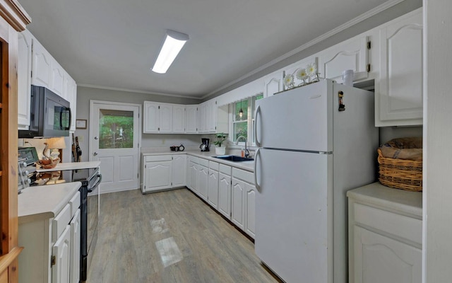 kitchen featuring light hardwood / wood-style floors, crown molding, electric range oven, white refrigerator, and white cabinets