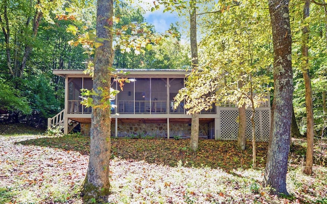 back of property featuring a sunroom