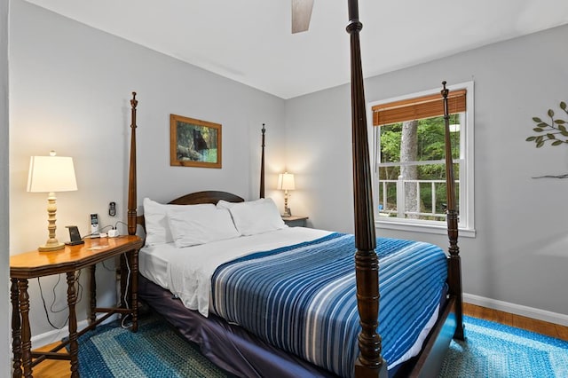 bedroom featuring ceiling fan and hardwood / wood-style floors