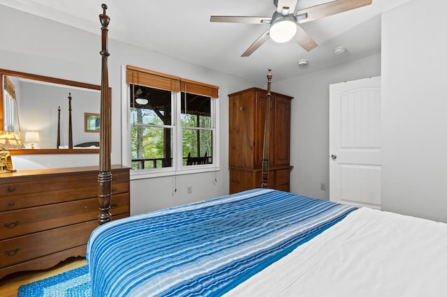 bedroom featuring hardwood / wood-style flooring and ceiling fan