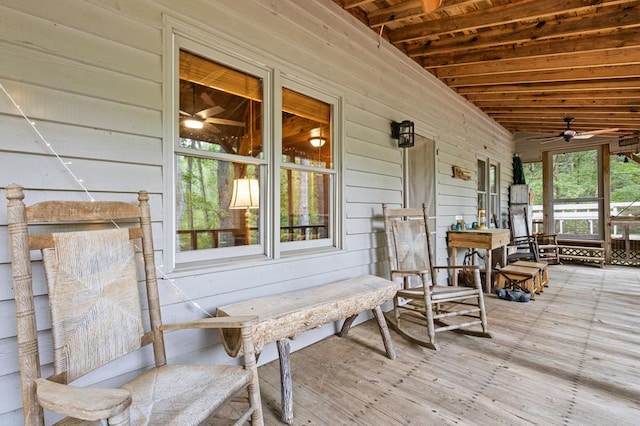 wooden deck featuring ceiling fan