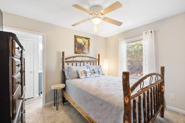 bedroom with baseboards, light carpet, and a ceiling fan