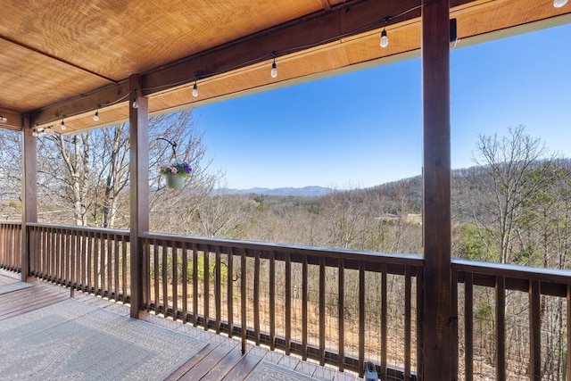 wooden terrace with a forest view